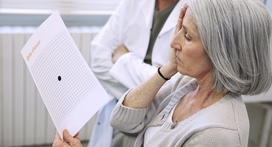 Woman using amsler grid to diagnose AMD